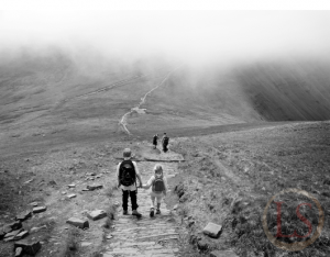 family walking down cribyn towards pen y fan